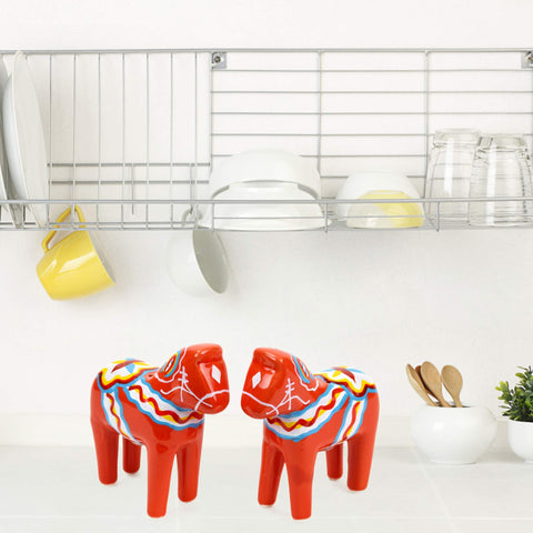 Essence of Europe Gifts orange-red Swedish motif decor for a Nordic touch in the kitchen.