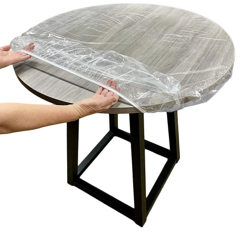Evelots clear round table cover protecting a 36-42 inch table surface.