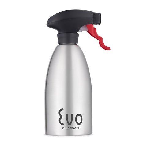 Evo Oil Sprayer with stainless steel body dispenses olive oil evenly for cooking.