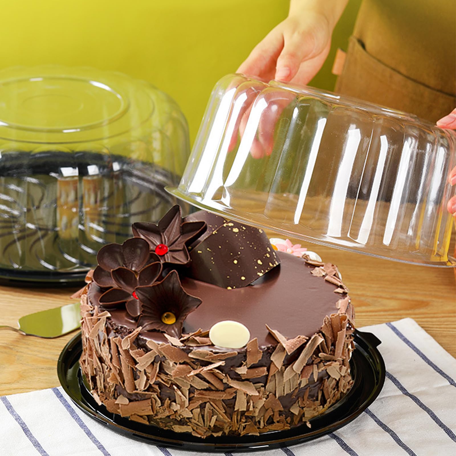EWAFILU cake containers displayed on a counter for guests
