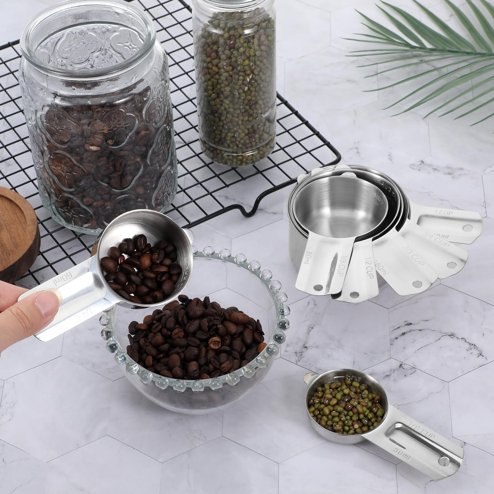 Exclaith measuring cups nest for space saving storage on kitchen shelves