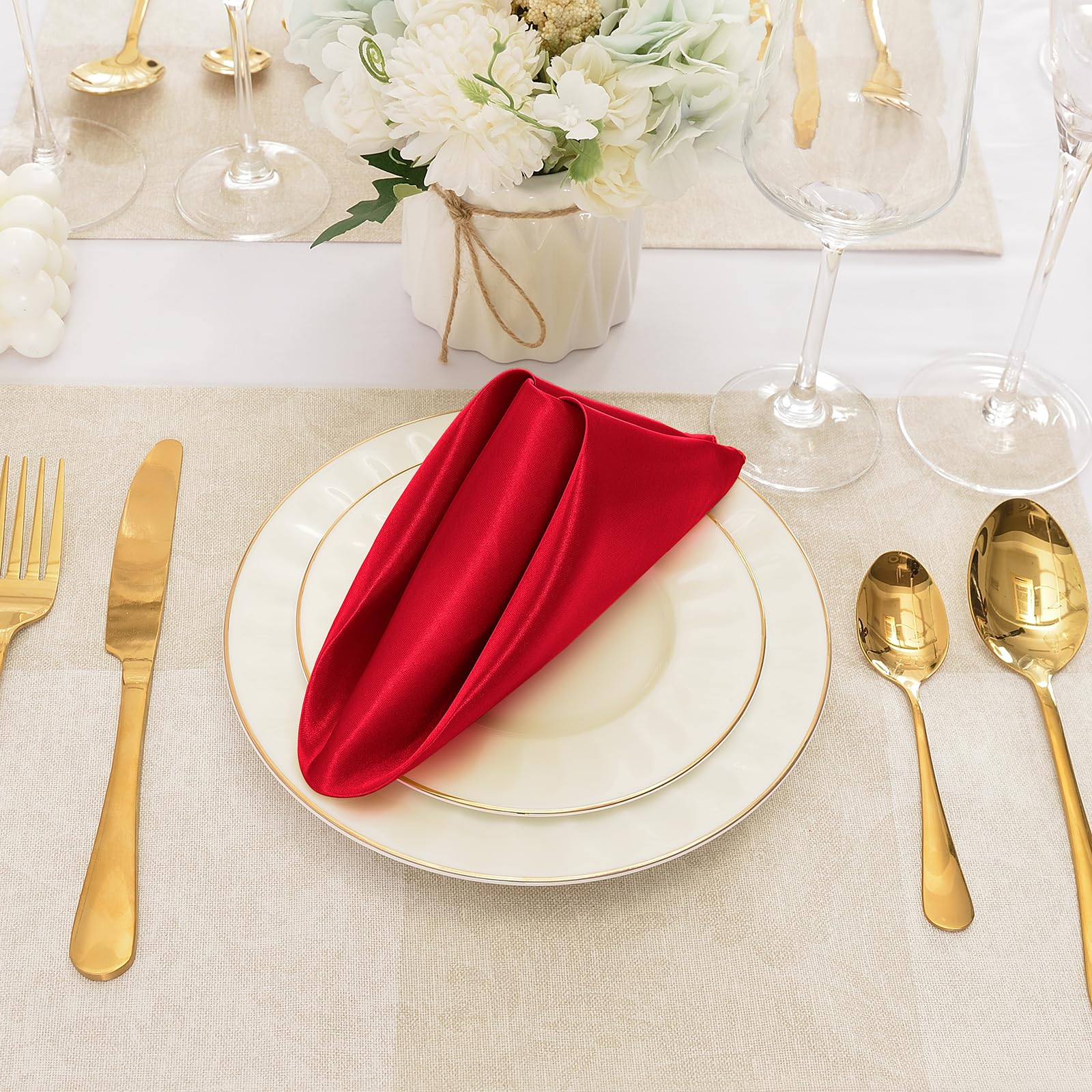 Eychei elegant table setting featuring red satin napkins for upscale dining