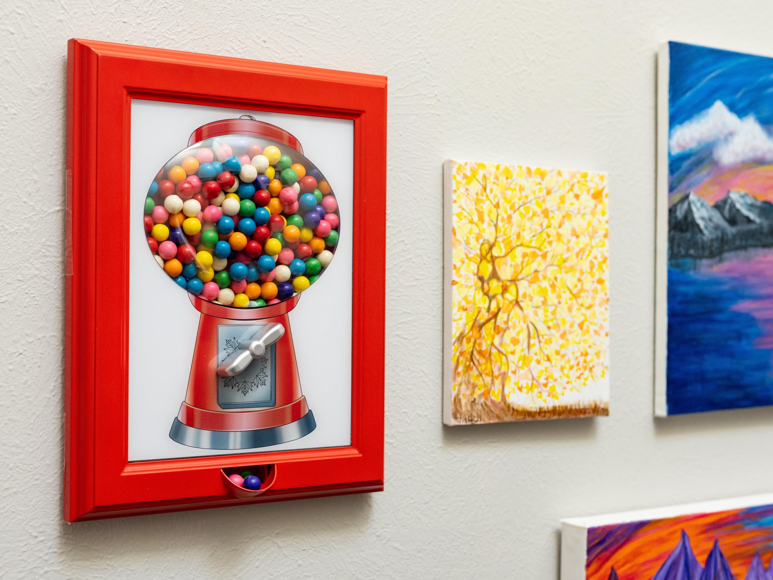 Eye Candy Frame turn handle dispensing treats into your hand