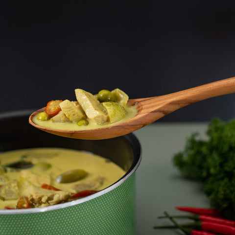 FAAY teak spoon in action for stirring and sautéing