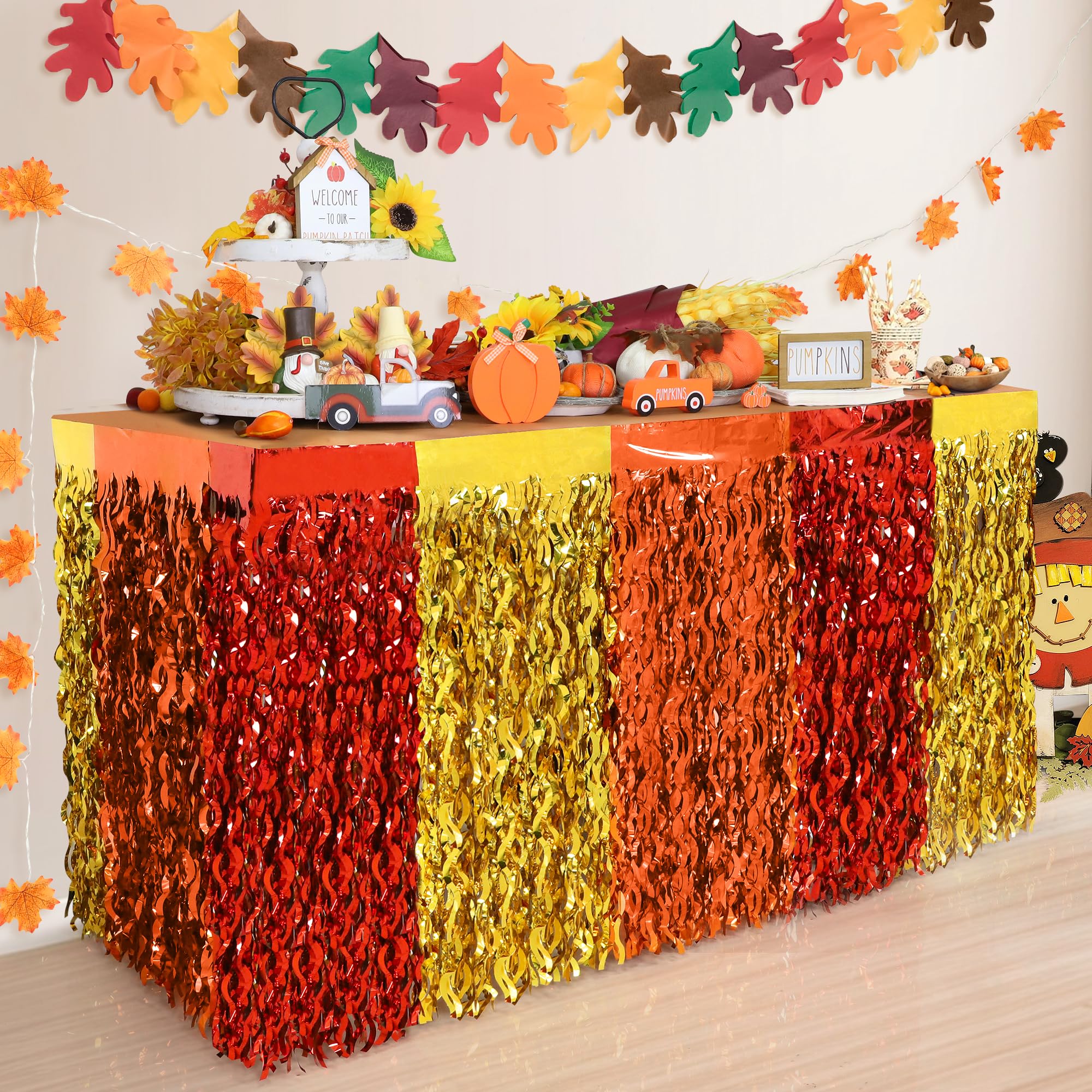 Faiclrr Fall table skirt with red orange gold fringe brightens festive tables.