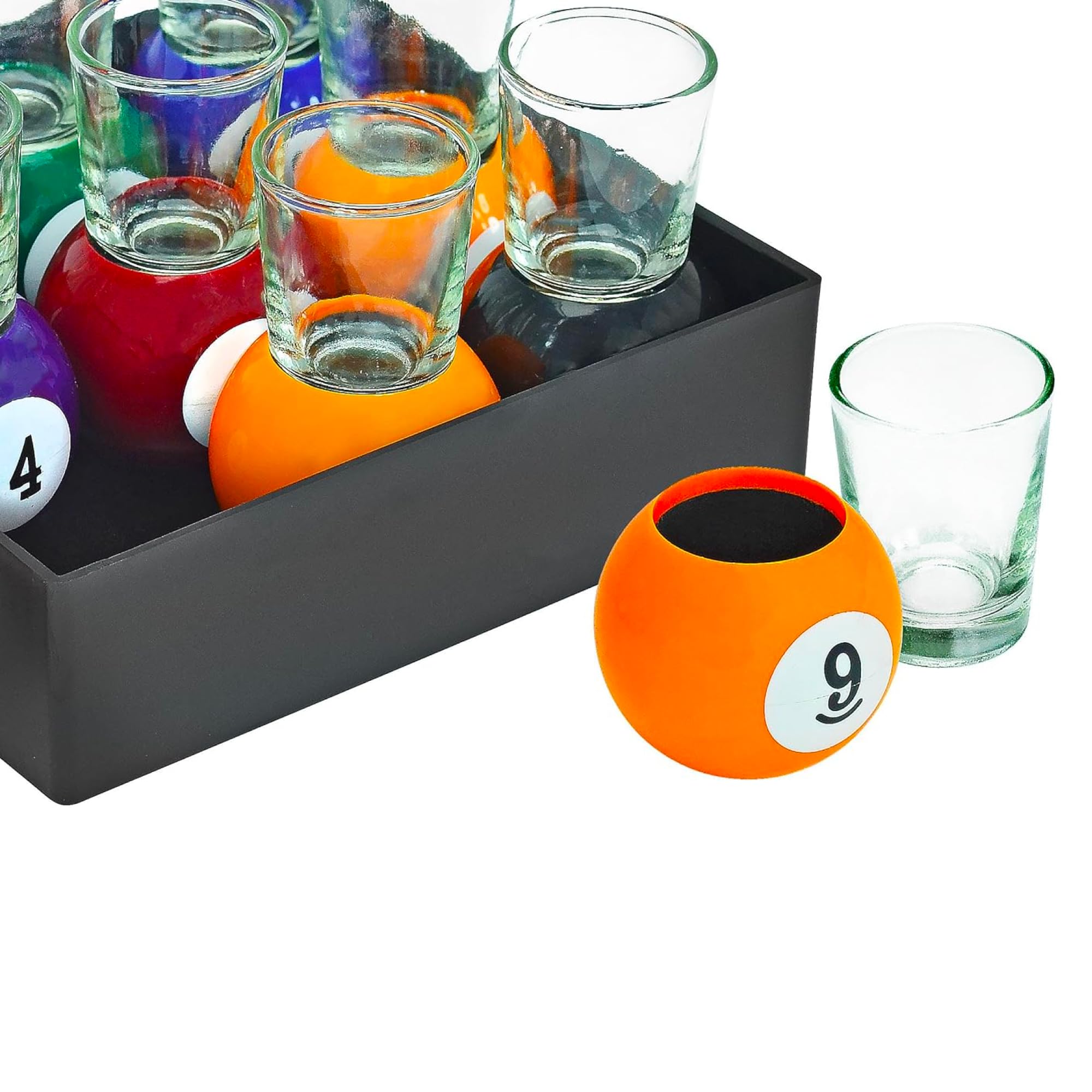 Close-up of a pool-ball base supporting a shot glass by Fairly Odd Novelties.