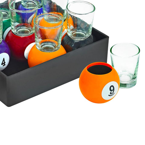 Close-up of a pool-ball base supporting a shot glass by Fairly Odd Novelties.