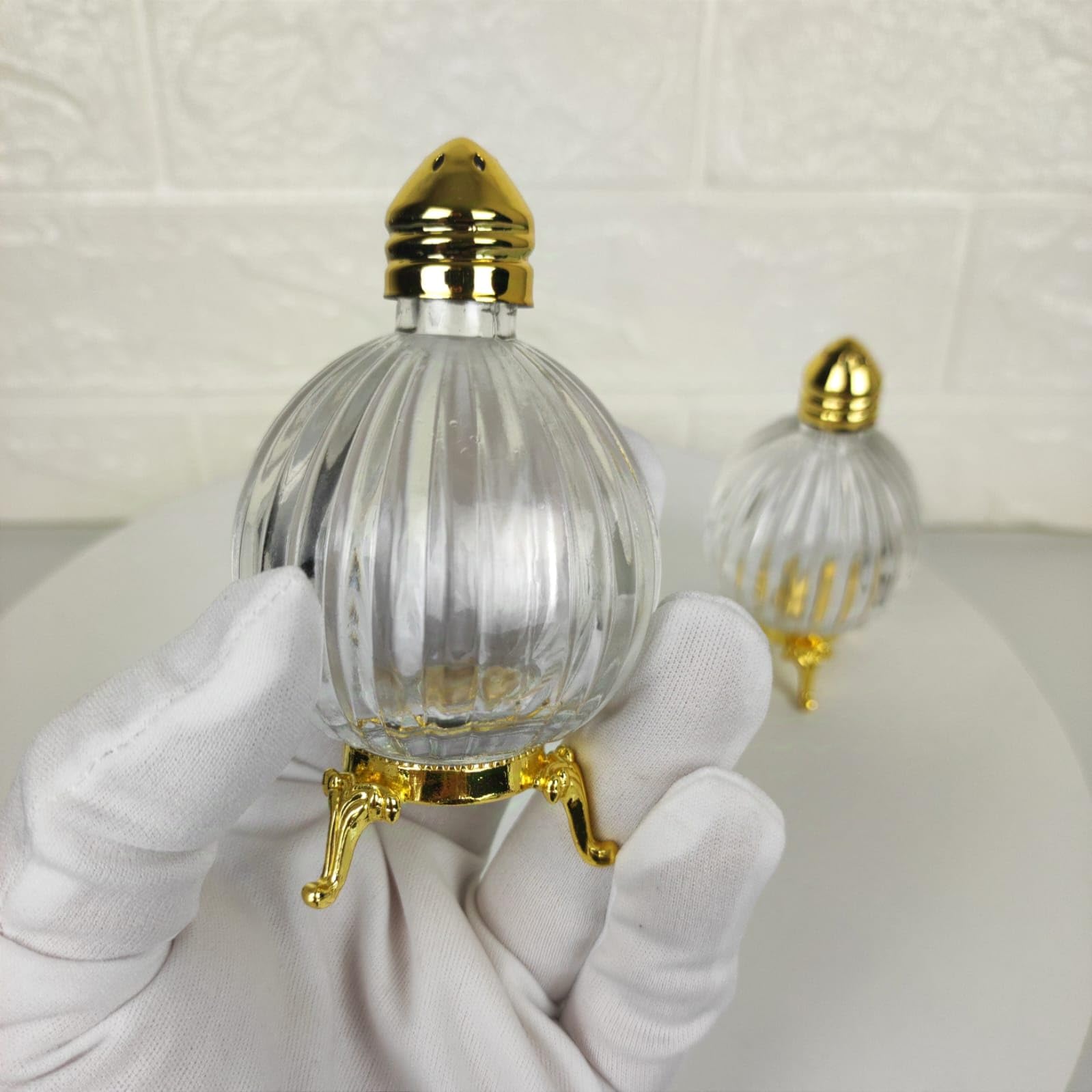 Fairturk globe salt shaker — ornate base detail radiates vintage-inspired charm.