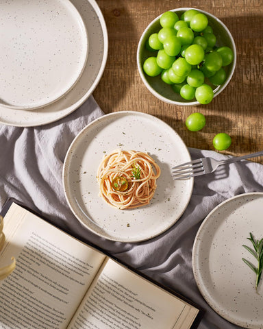 Creamy glaze with red and blue speckles on Meteor dishware.