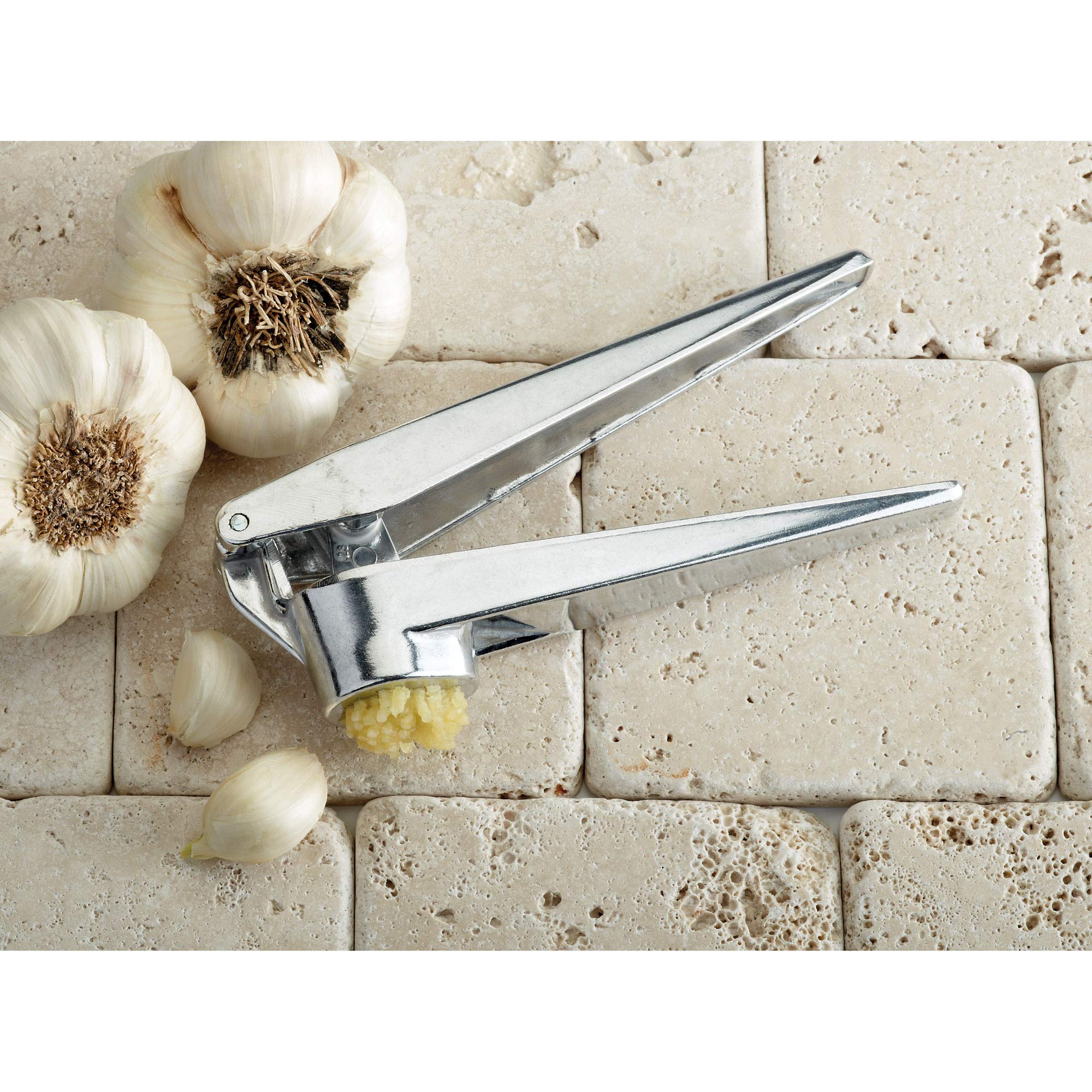 Cleaning tool included helps remove stuck food bits after use.