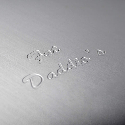 Fat Daddio's anodized round cake pan, hand wash recommended for lasting shine.