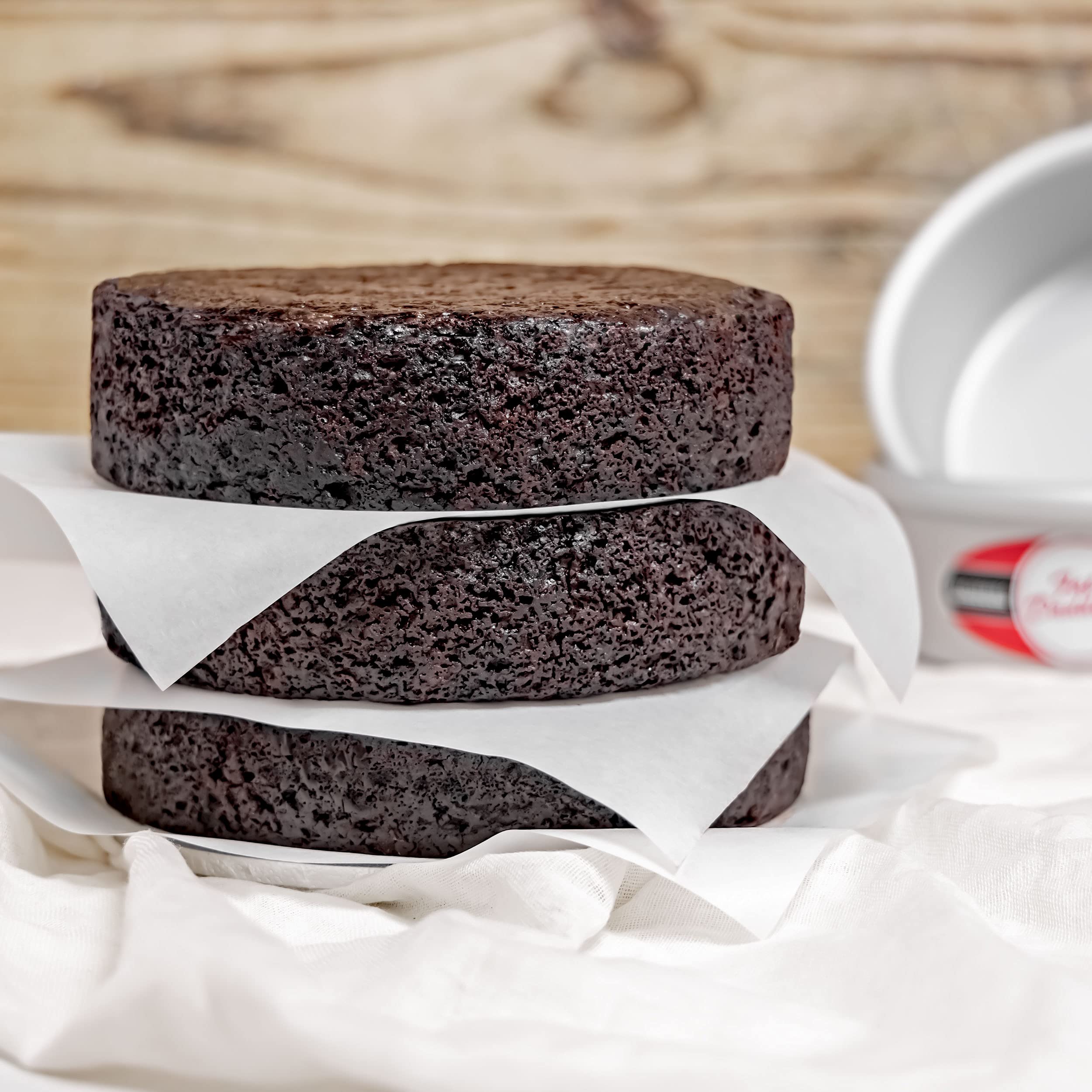 Fat Daddio's anodized round cake pan side view highlights sturdy build and even heating.