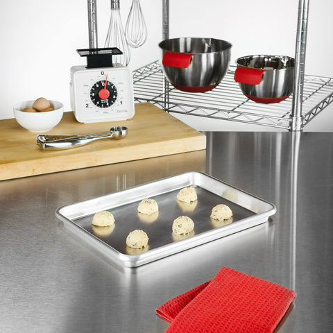 Cookies baking on Fat Daddio's SP-QTR quarter sheet pan highlight versatile pastry use.