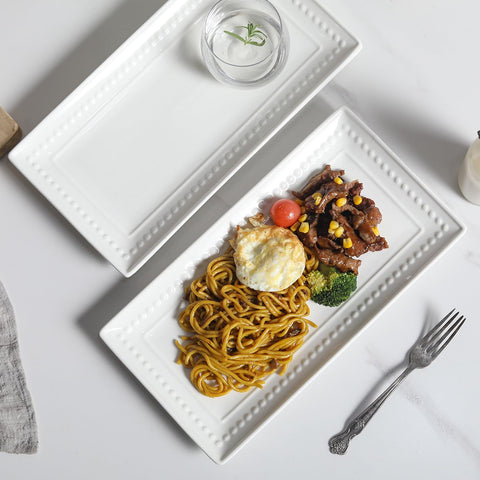 Feenmai rectangular white platters complement traditional or modern table settings.