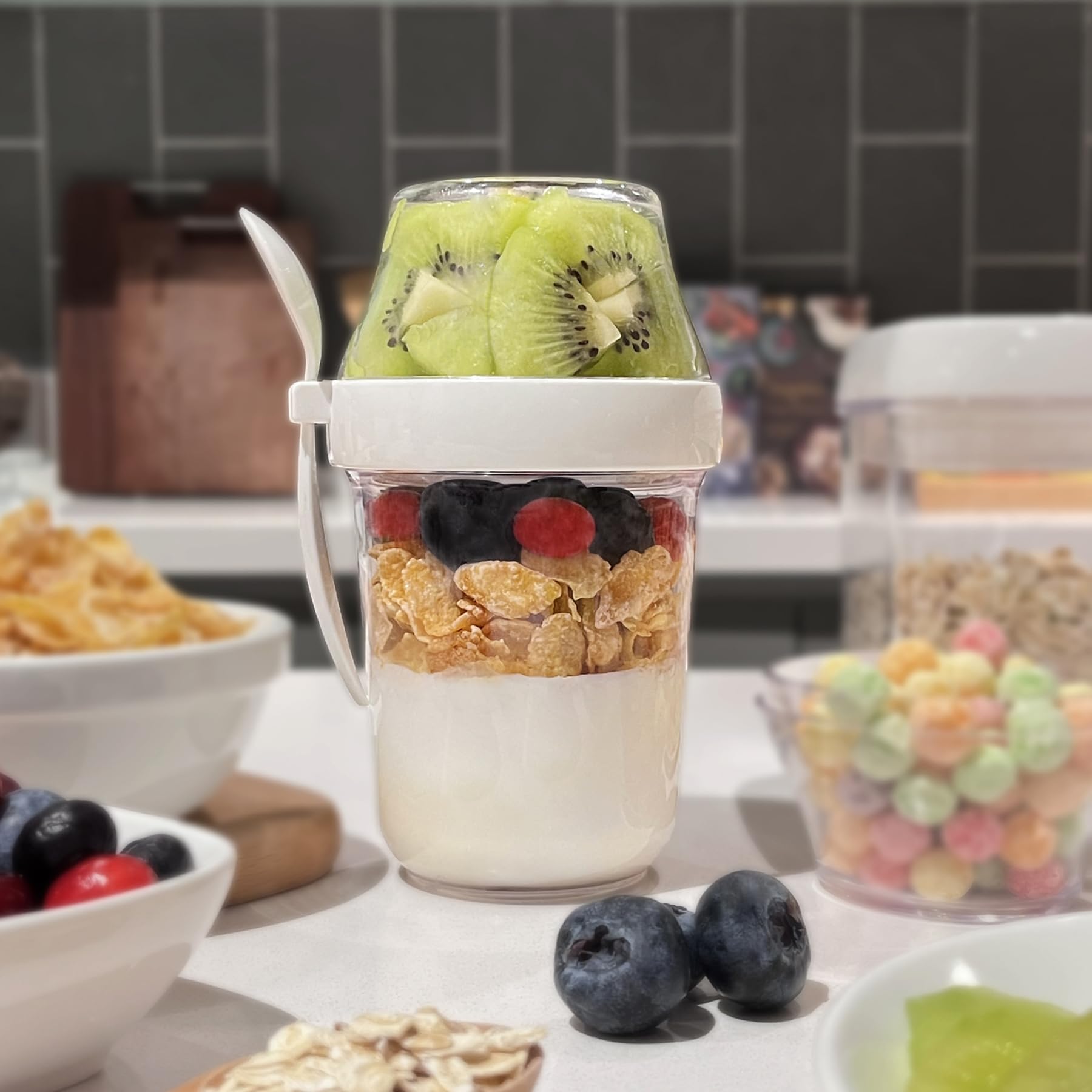 Felli snack cup with spoon and lid demonstrates convenient spill-free travel.
