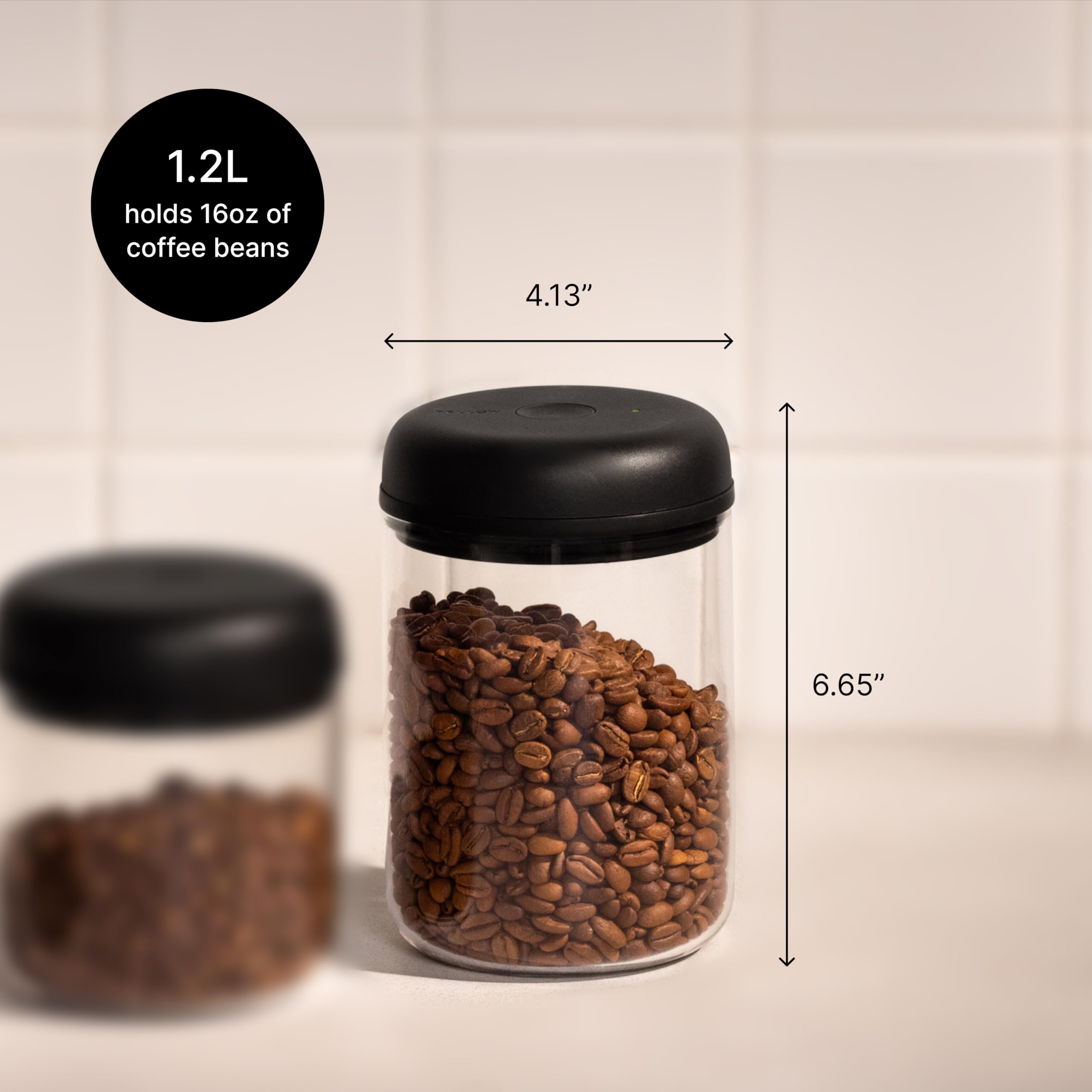 Fellow Atmos canister with coffee beans maintains aroma and freshness