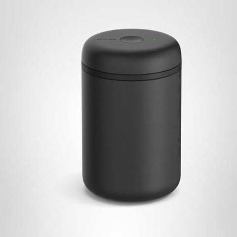 Fellow Atmos matte black 1.2L canister on a stylish counter