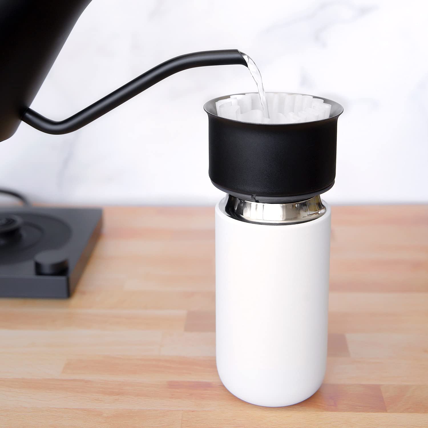 Fellow Carter Move travel mug ceramic interior preserves pure flavor on the go.