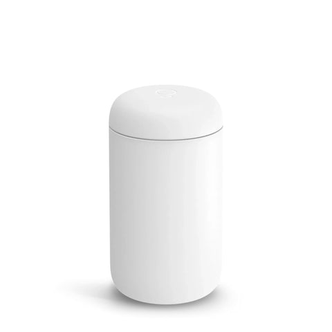 Fellow Carter wide travel mug with ceramic interior for rich flavor on the go.