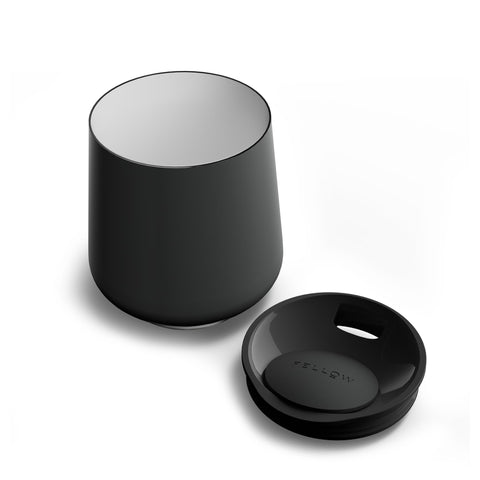 Fellow Ruby tumbler with swivel pebble lid prevents splashes while sipping.