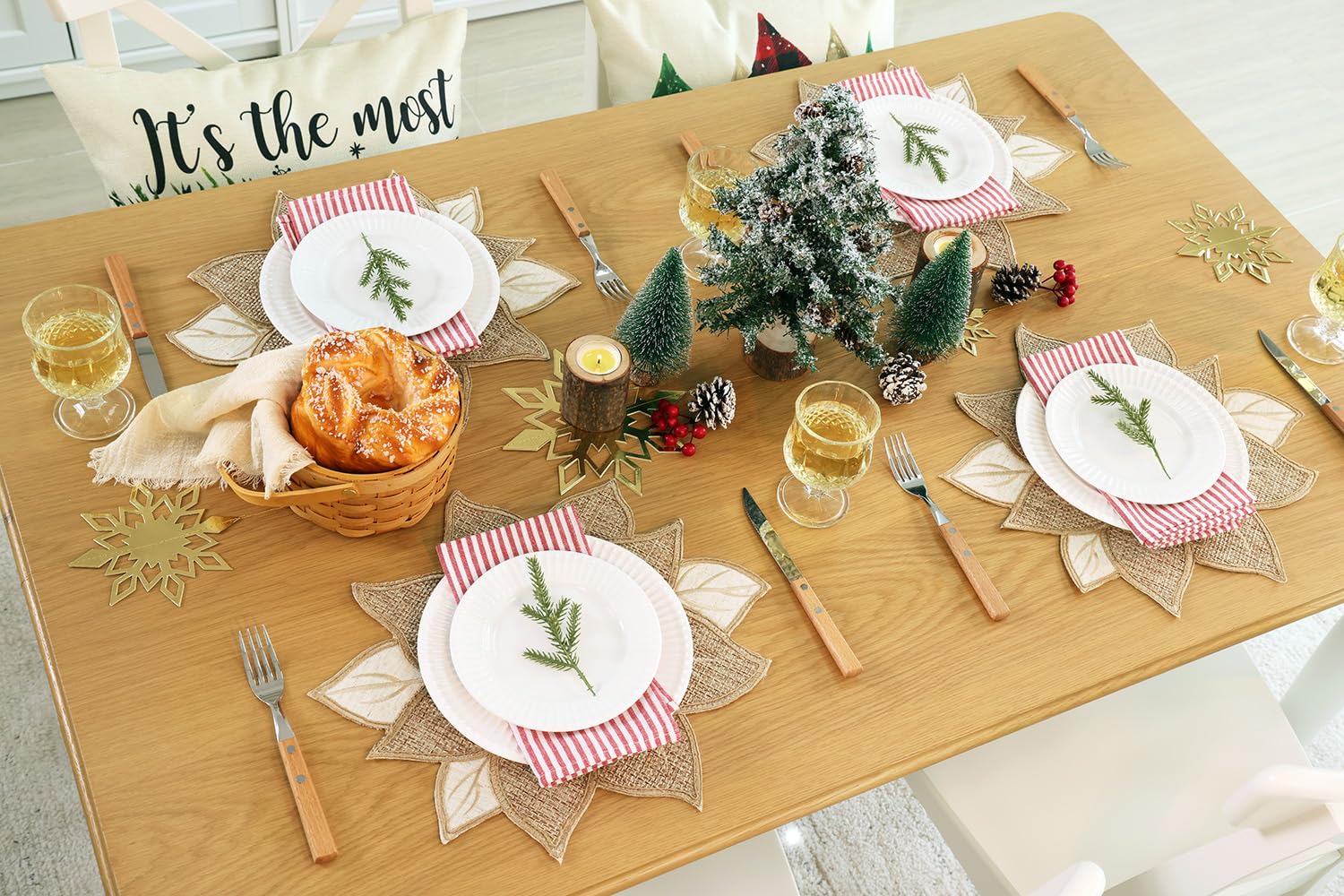 Feuille Christmas placemats set on dining table create festive ambiance.