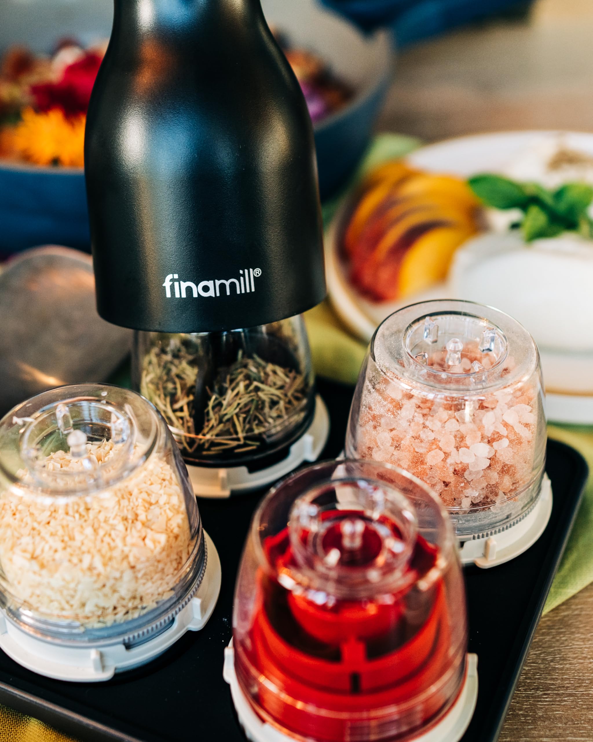 FinaMill battery-operated spice mill in use with one-handed grinding