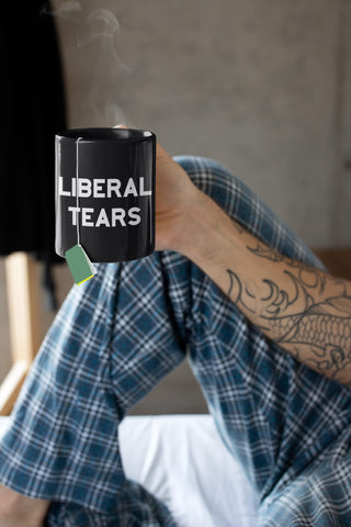 Find Funny Gift Ideas Liberal Tears Mug held for a coffee break
