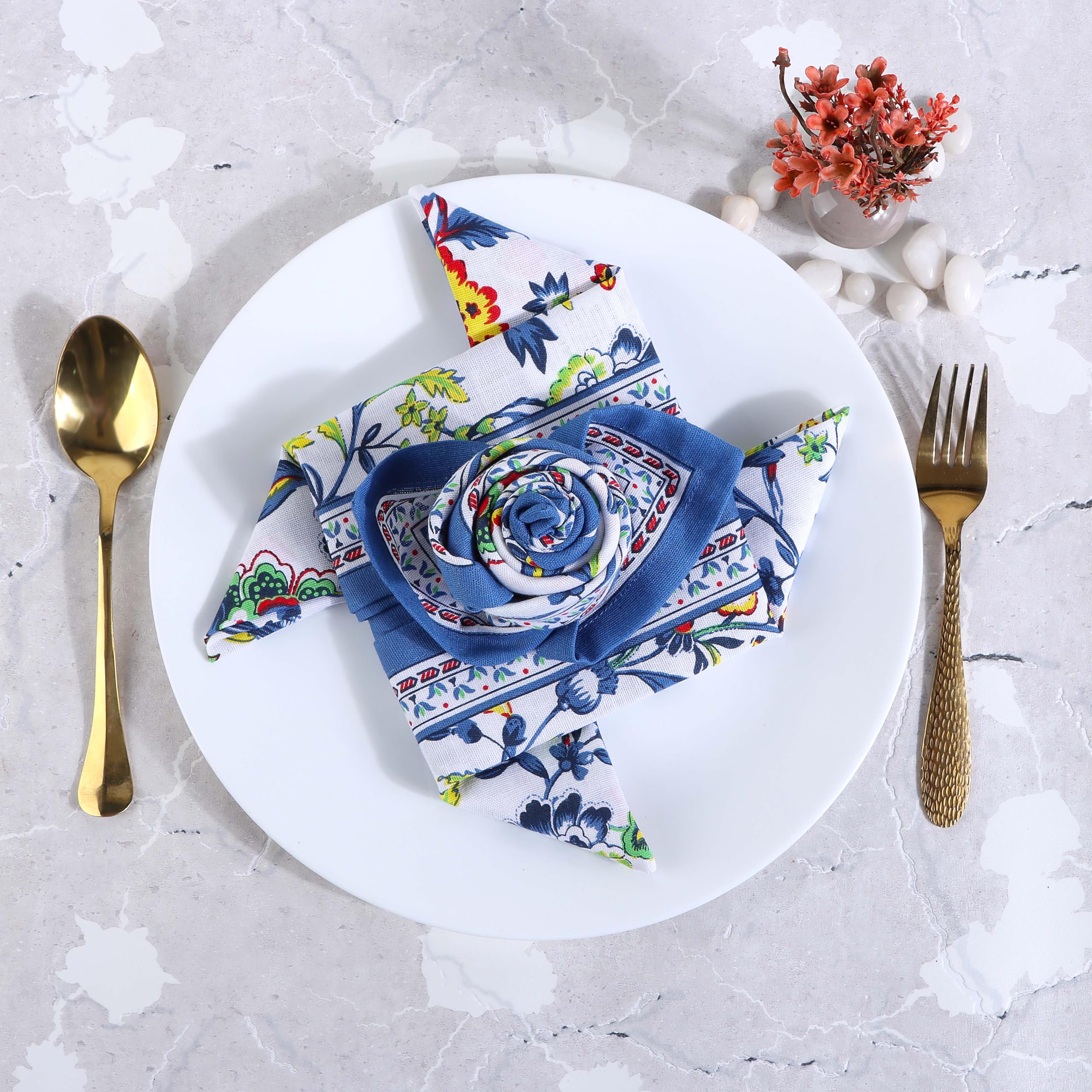 Fingercraft blue floral napkins arranged on a dining table for home dinners