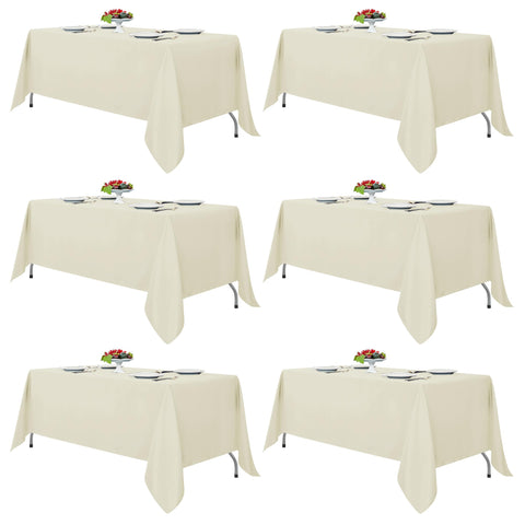 Fitable Ivory tablecloth spreads on a banquet table for 6-8 guests.