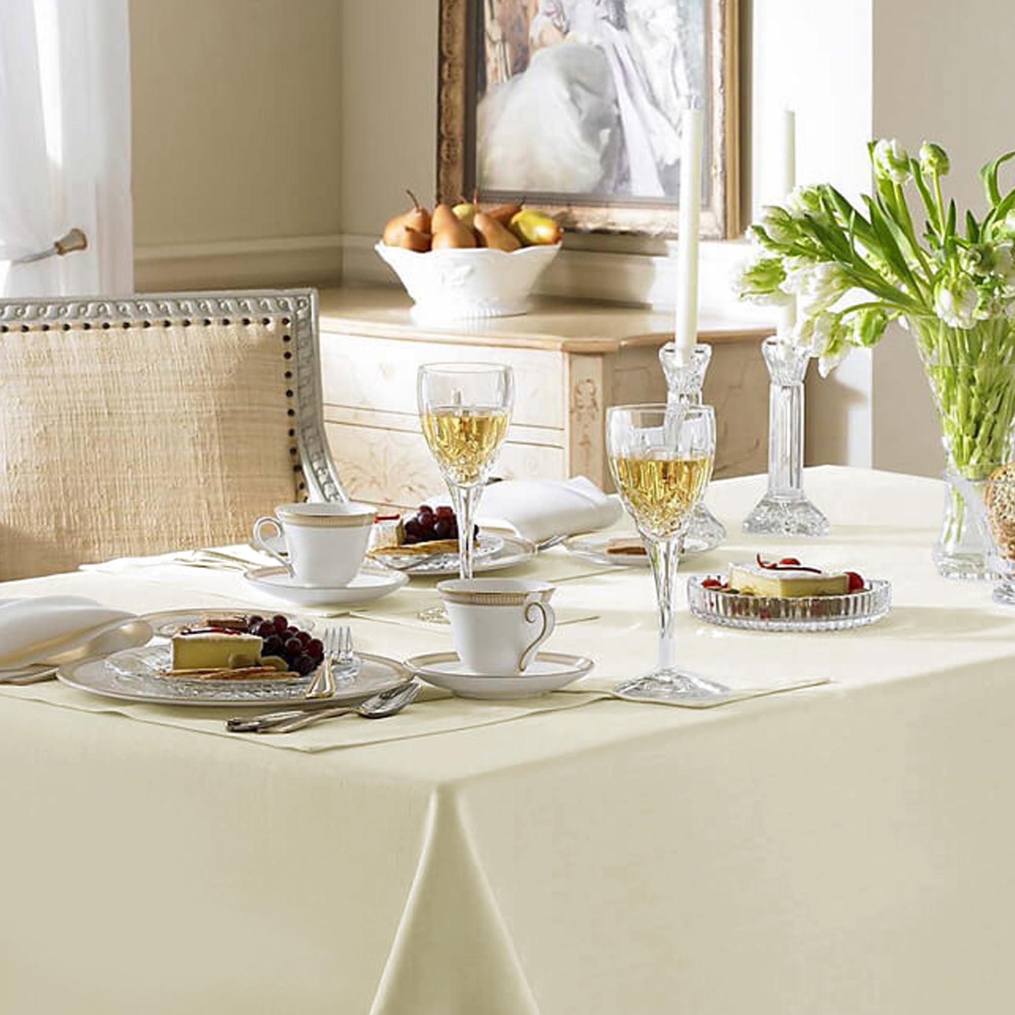 Spill-proof styling with Fitable Ivory Tablecloth helps quick cleanup.