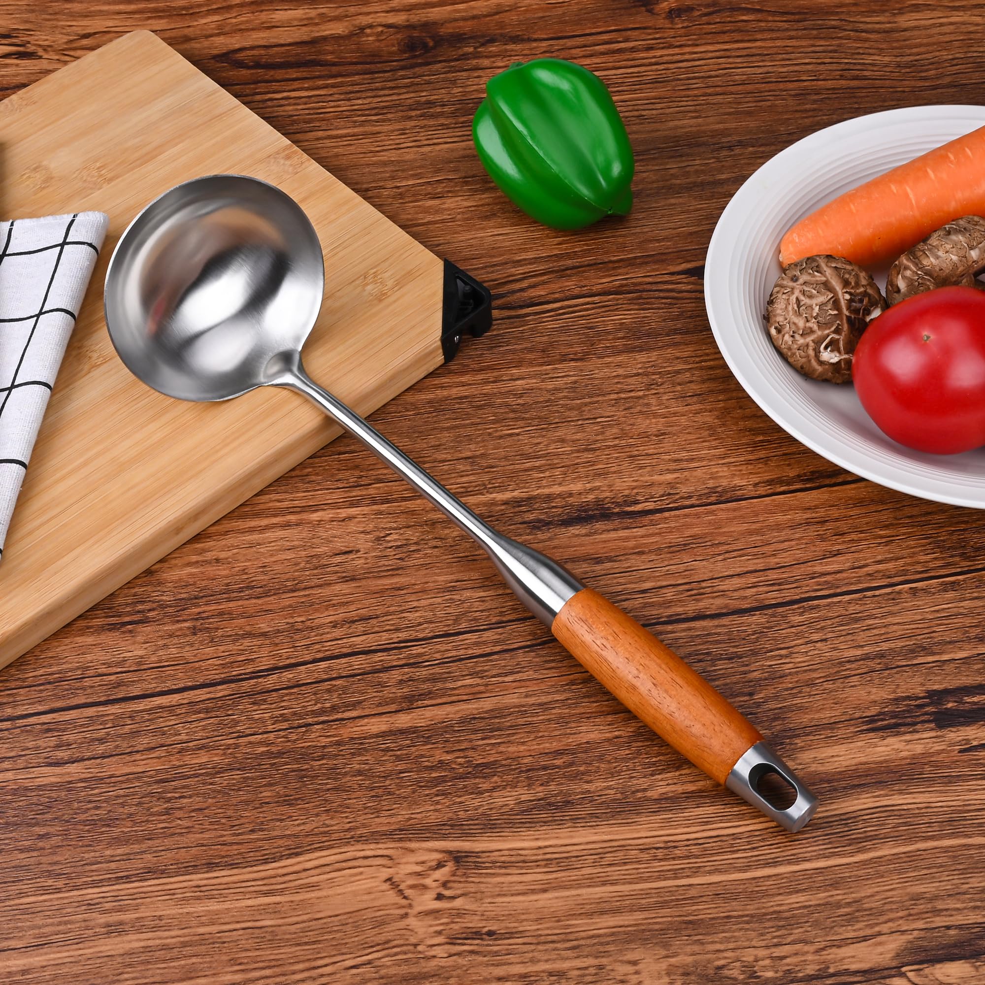 FJNATINH ladle with heat-resistant wooden handle for safe serving.