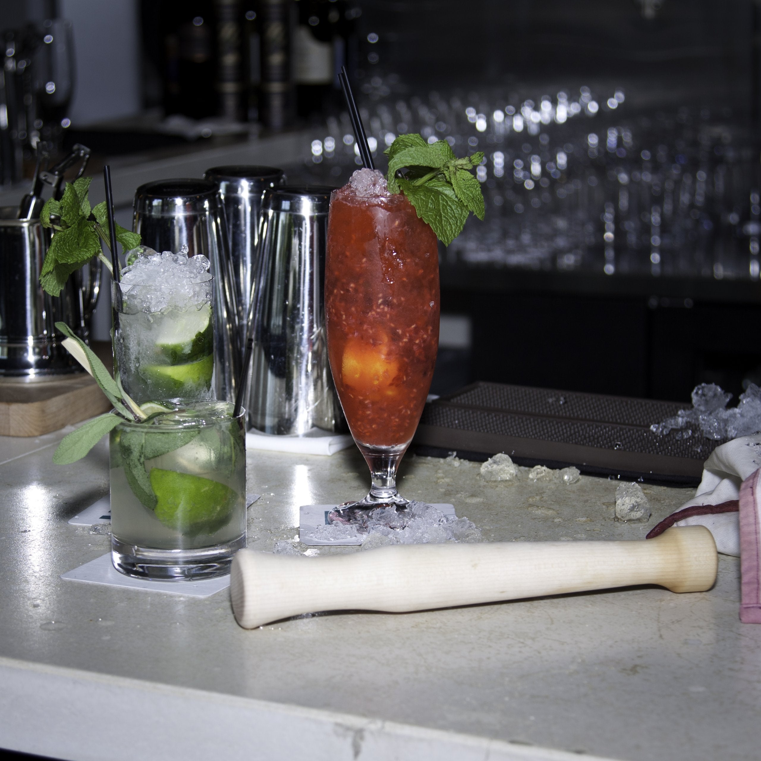 Ergonomic handle of Fletchers Mill muddler offers comfortable grip while crushing citrus.