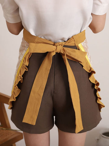 Floosum embroidery lace yellow apron closeup showcases vintage-inspired design.