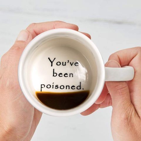 FLY SPRAY poisoned mug office desk scene demonstrates ideal conversation starter