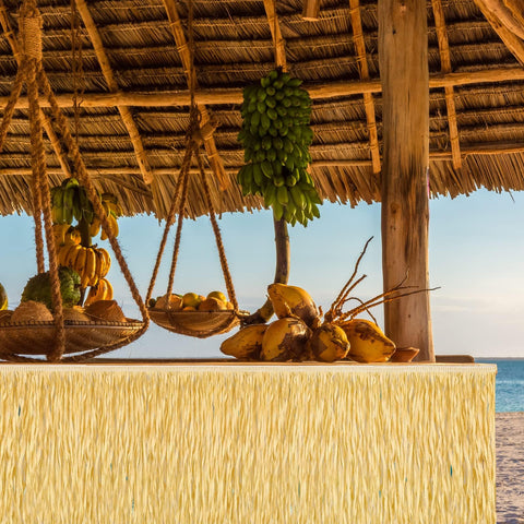 Fovths luau grass table skirt displayed on stairs or walls for dramatic effect