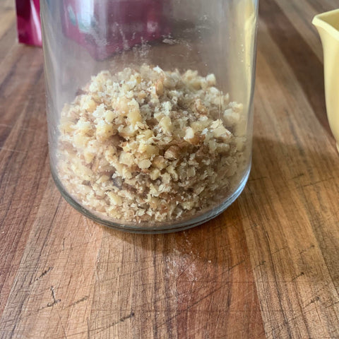 Fox Run 5716 nuts in top lid ready to chop for fresh prep