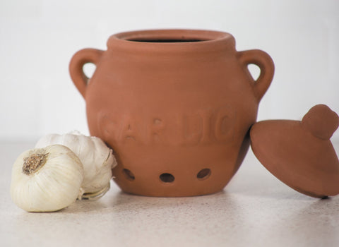 Fox Run garlic keeper garlic-shaped handle adds whimsy and grip.