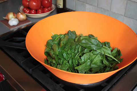 Frywall 12-inch guard prevents spillover during busy sautéing