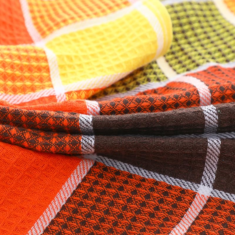 Fucibt orange check bar towel, ready for quick kitchen cleanup near stove
