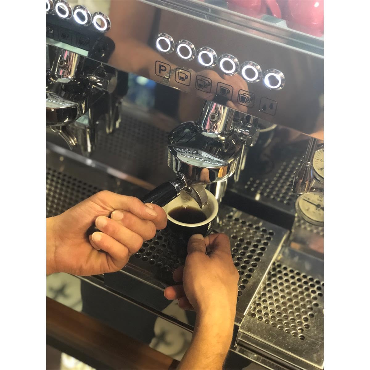 Gaggia decalcifier bottle pour shows ready-to-use descale flow.