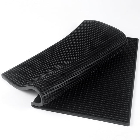 Garandad bar mat absorbs spills during cocktail preparation.