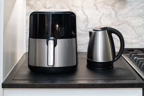 Gasaré silicone mats provide a non-slip surface under appliances
