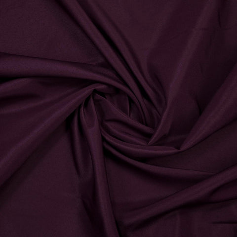 Gee Di Moda eggplant tablecloth at wedding reception adding rich color