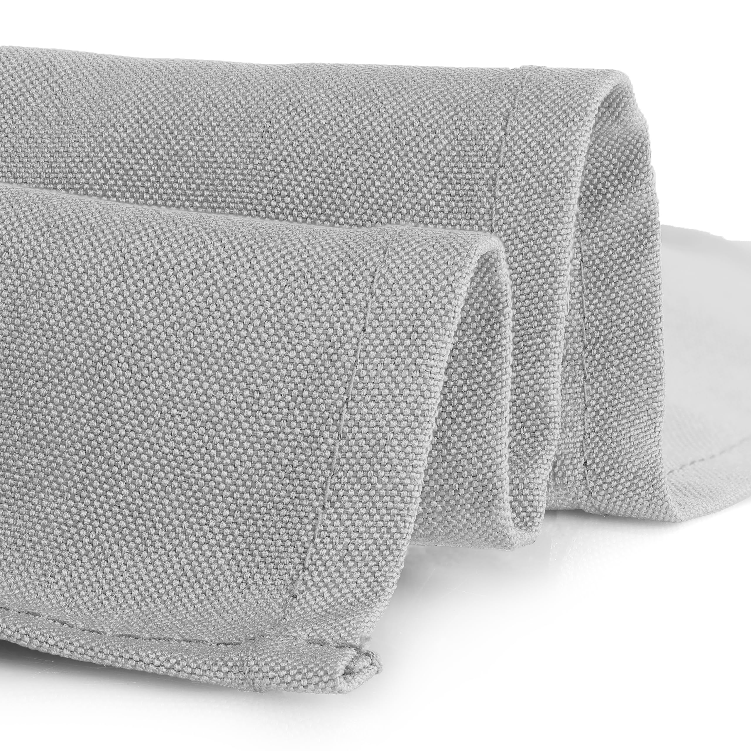 Gee Di Moda table setting on silver cloth for formal dining.