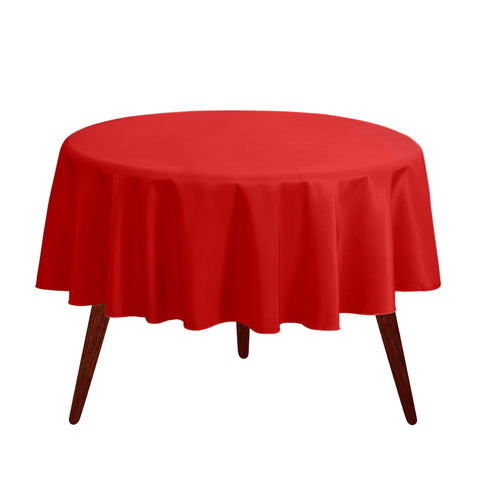 Gee Di Moda round tablecloth in red drapes a 60-inch table, adding festive coverage.