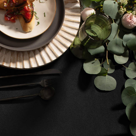 Gee Di Moda tablecloth with hemmed edges enhances formal dining presentation.