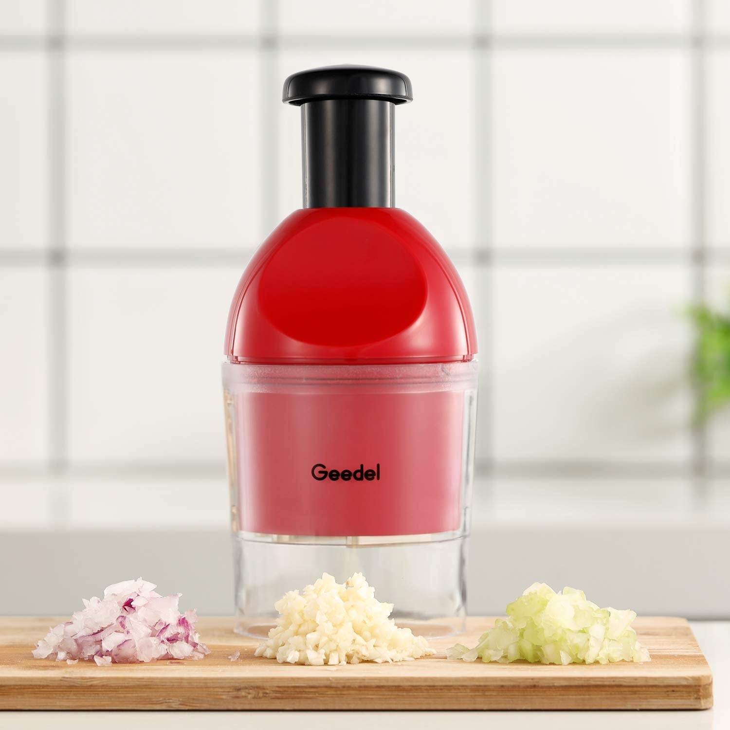 Geedel Food Chopper with red handle highlighting vibrant kitchen color and design.