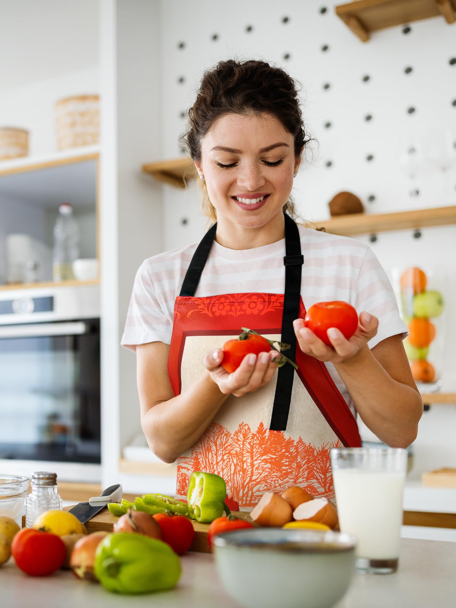 Geetery red rooster-print apron featuring vibrant design for cooking and baking.