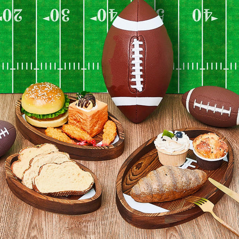 Geetery football trays arranged in a tailgate setup for party decor and serving