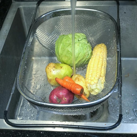 Generic colander doubles as a fruit and vegetable basket on the countertop.